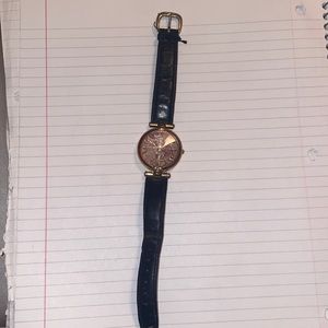 Fossil watch with black wrist band.